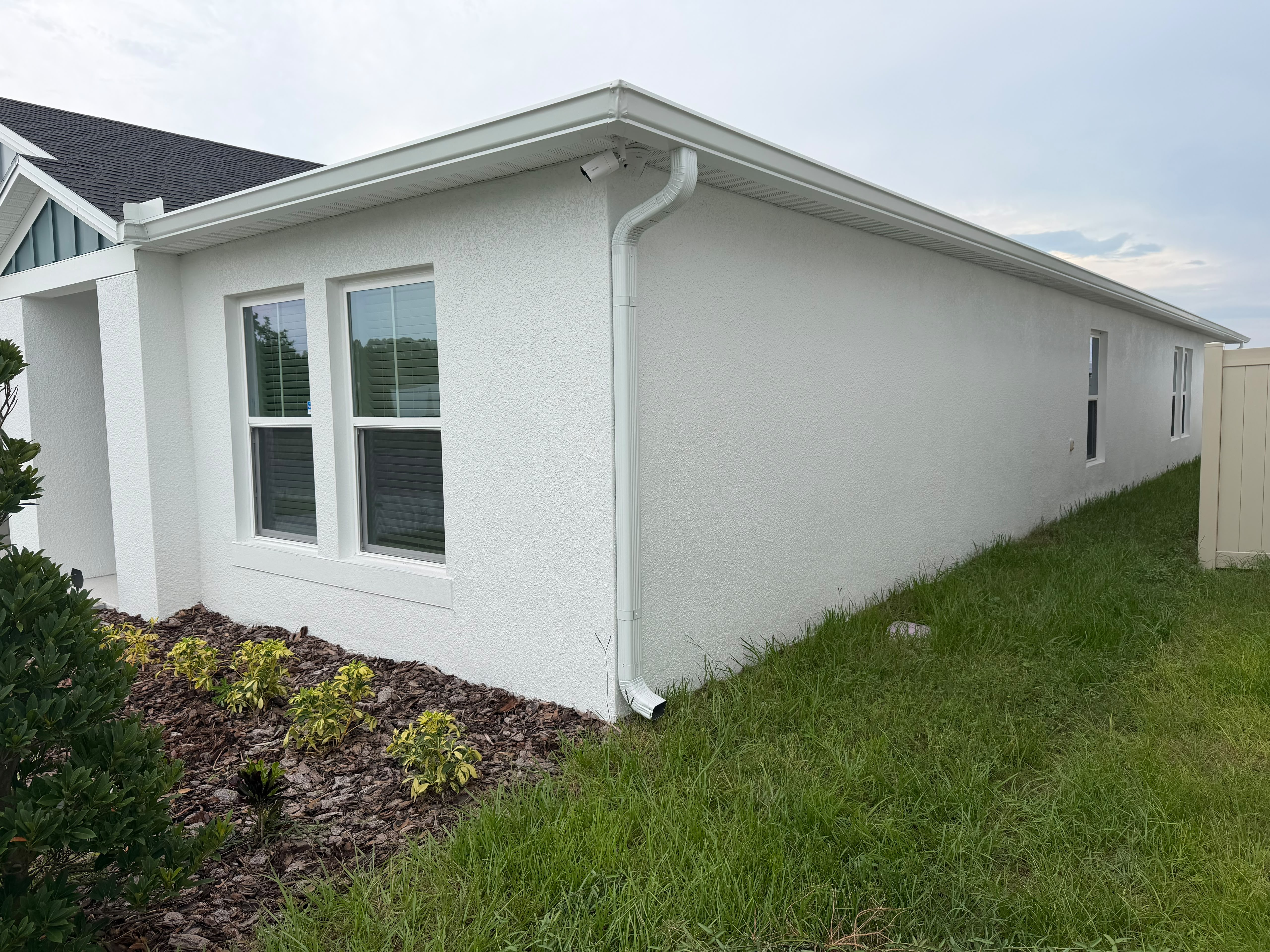 Completed seamless gutter and downspout installation on a Florida home